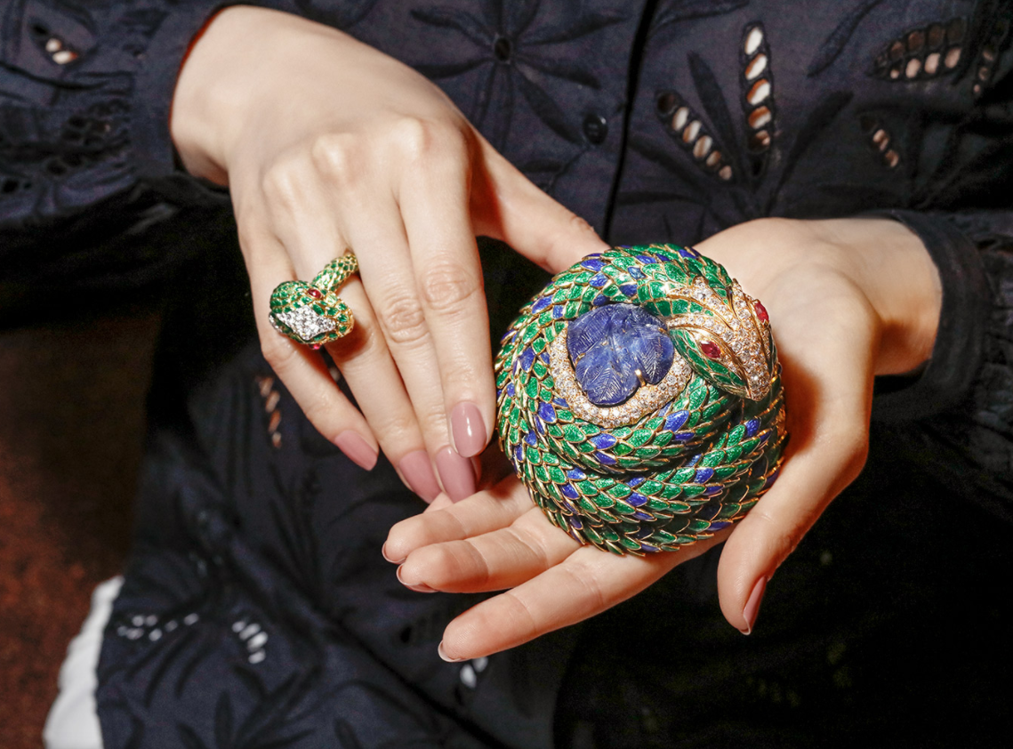 David Webb 'Snake' ring with cabochon rubies, brilliant cut diamonds and green enamel in 18k gold and platinum, and 'Snake' box with carved sapphire, faceted oval cut rubies, brilliant cut diamonds, and blue and green enamel in 18k gold